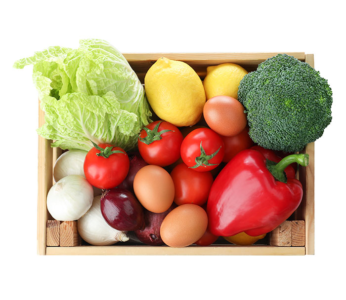 fresh vegetables in a wooden box